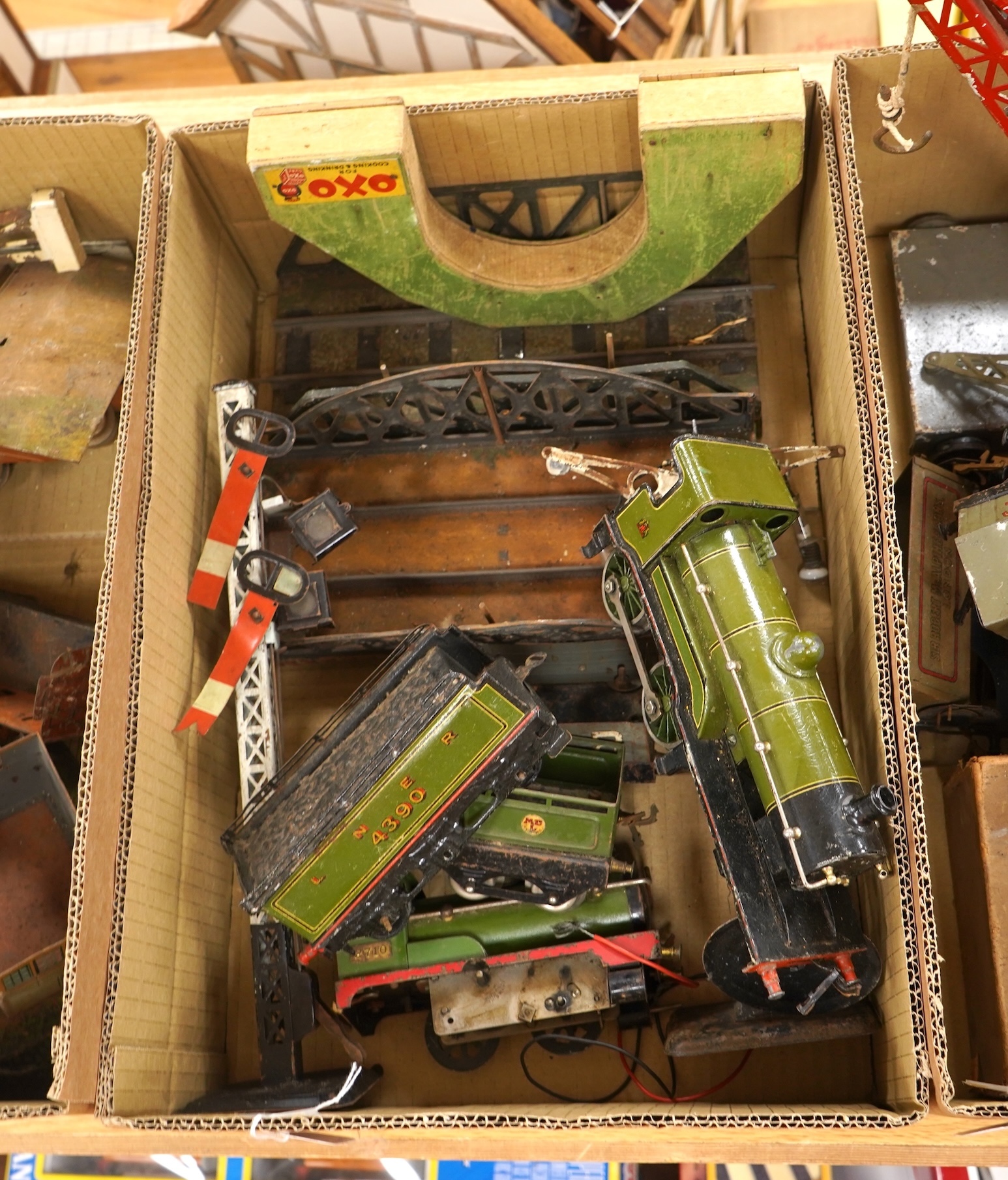 A Bing for Bassett Lowke 0 gauge tinplate clockwork LNER Ivatt 4-4-0 tender locomotive, 4390, together with an early Hornby clockwork 0-4-0, 2710, in GNR green livery with Meccano Ltd roundels to locomotive splasher and